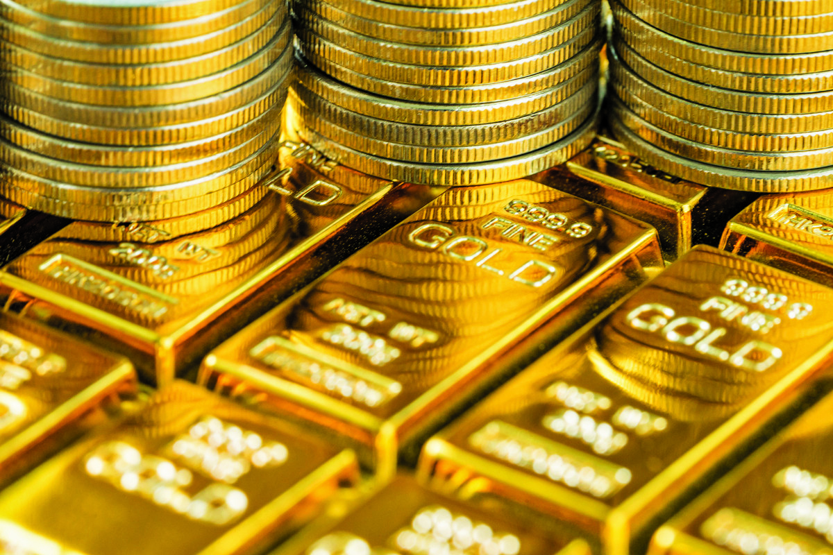 uggestions (for images): Gold bars representing rising gold prices in Qatar market