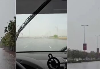 Dubai road flooded during heavy rainfall with low visibility