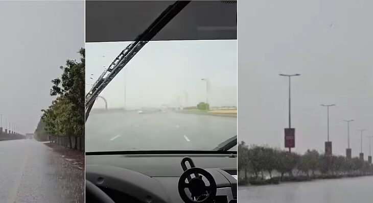 Dubai road flooded during heavy rainfall with low visibility